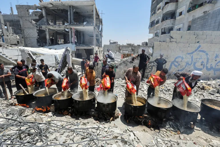Charity kitchen feeds dozens in the rubble of Khan Younis city